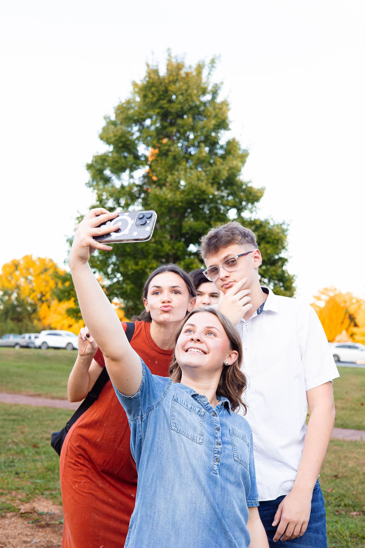 Nathanael Greene park a group of siblings take a selfie before their session with Refined by Fire Photography starts in Springfield MO