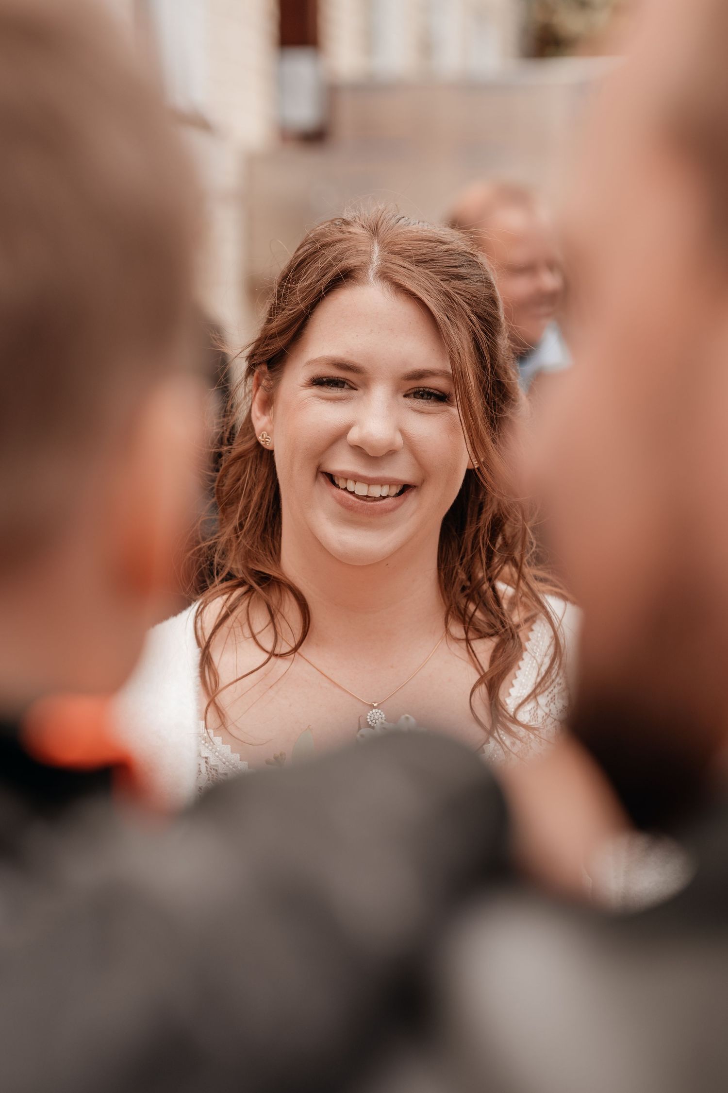 Candid wedding ceremony moments captured in warm natural light.