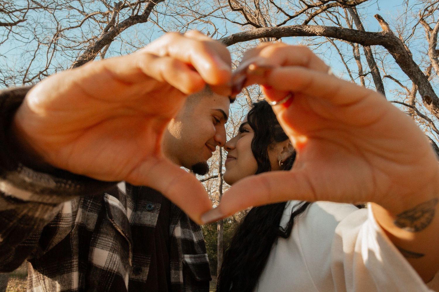 Couples shoot through a heart