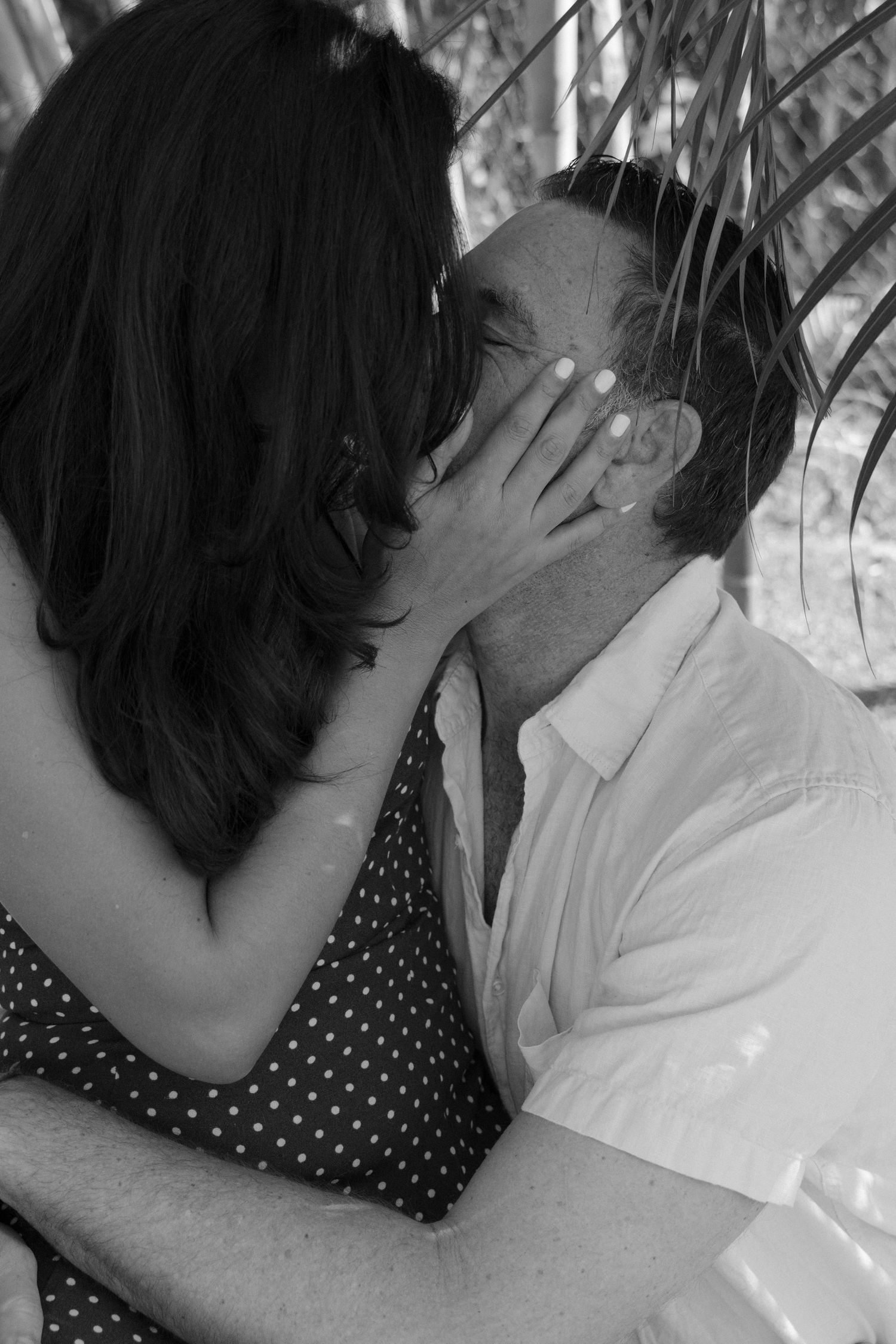 Black and white photo sequence showing a couple in polka dot dress and white shirt sharing an intimate moment.