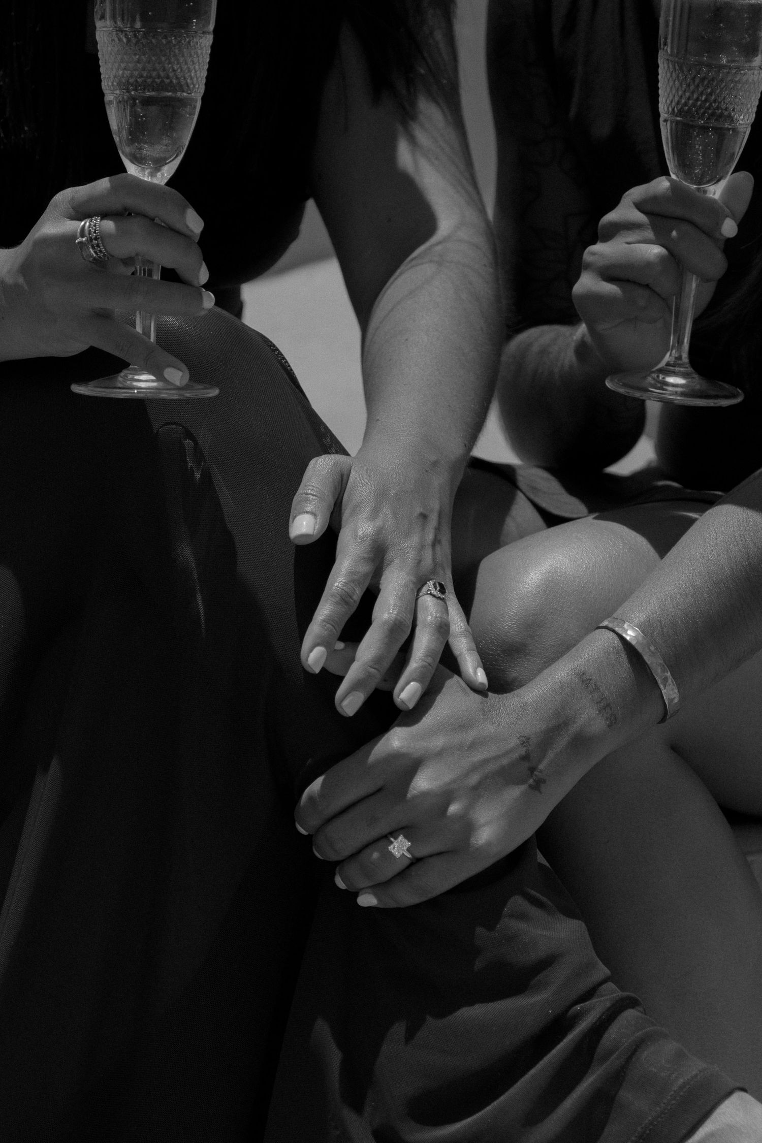 Black and white massage therapy images showing hands performing therapeutic techniques on a client's back.
