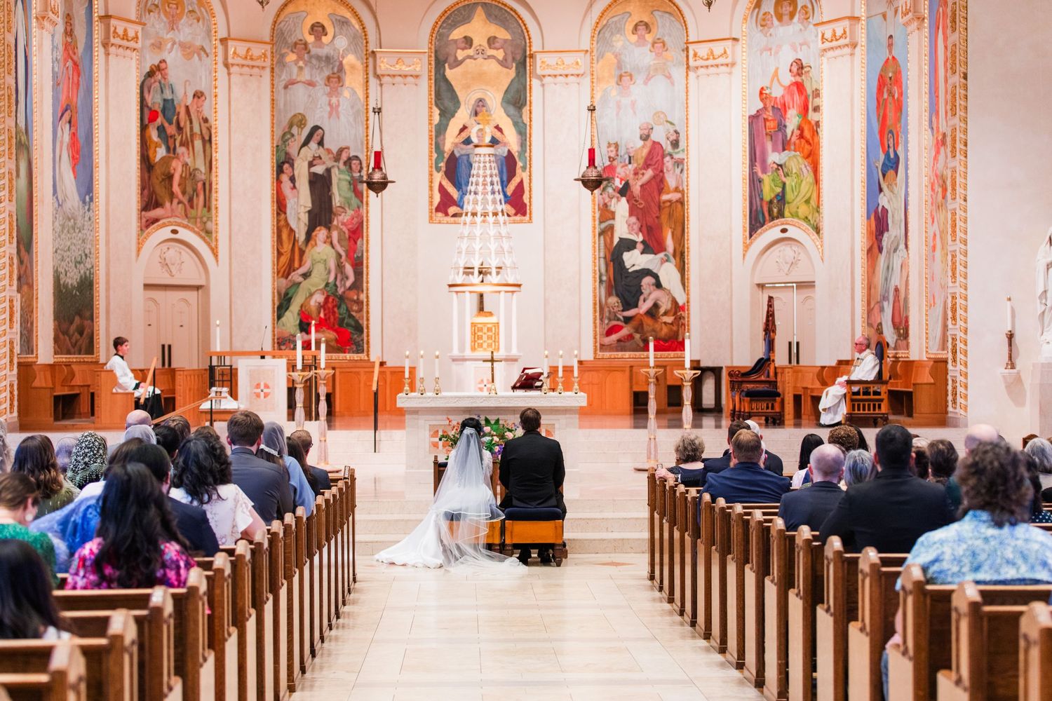 Religious ceremony taking place inside a St. Marys Cathedral of the Immaculate Conception Catholic church in OR.
