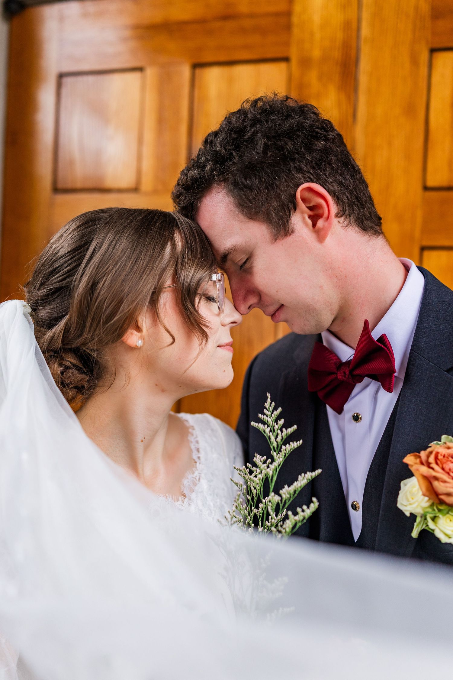 Intimate wedding portrait series showing tender moments between newlyweds.
