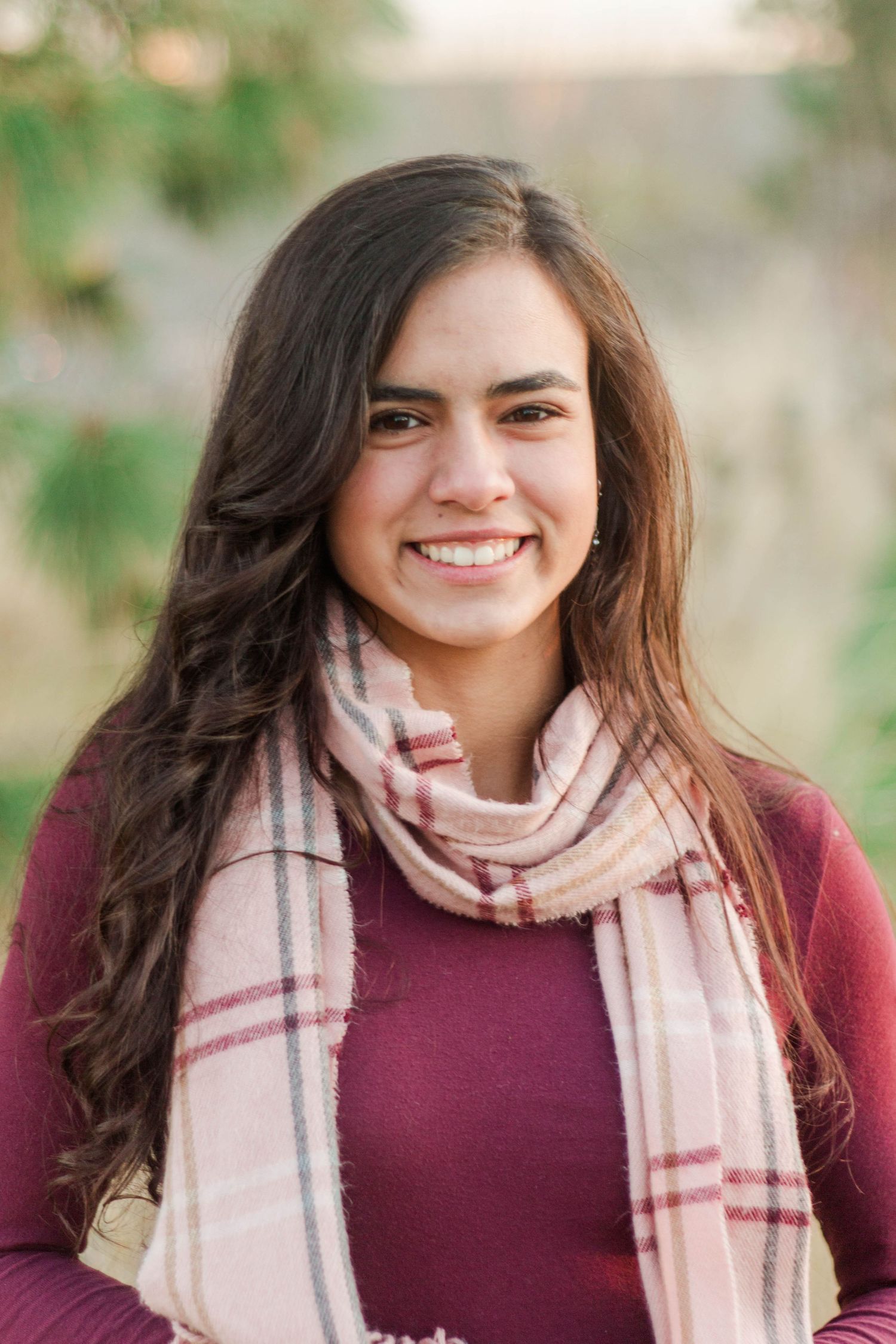 Portrait sequence showing someone wearing a burgundy sweater and plaid scarf.
