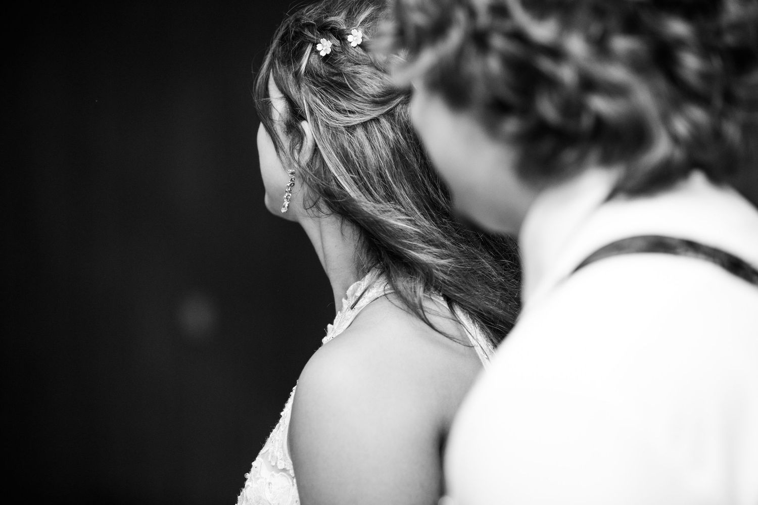 Black and white intimate portrait of couple in soft lighting.