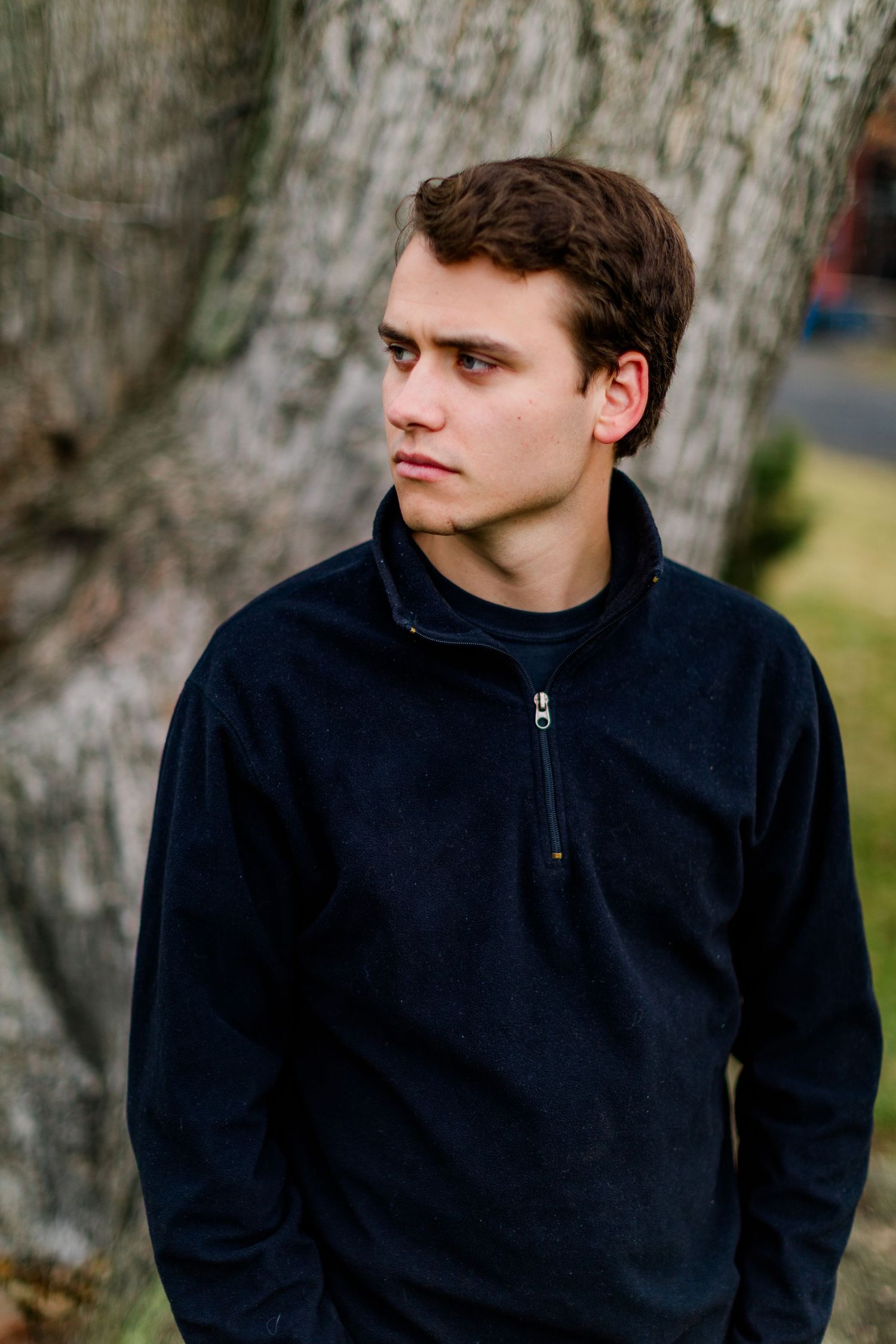 Series of moody portraits against textured tree bark background.