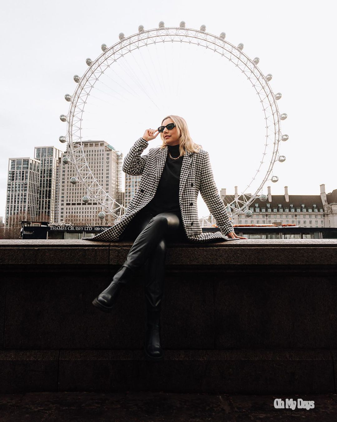 Fashion portrait with London Eye forming perfect circular backdrop.