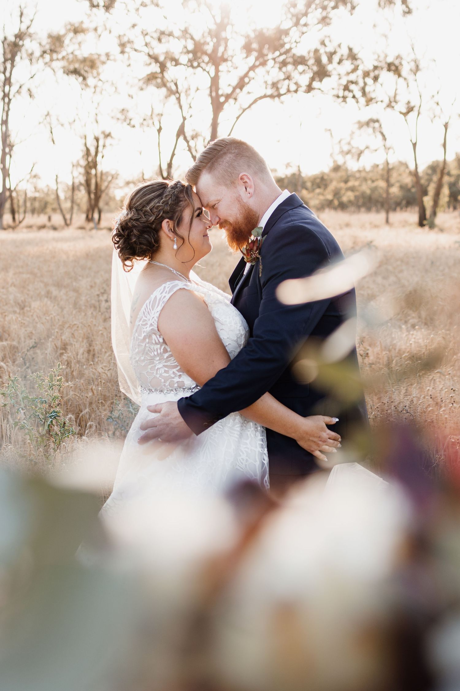 Bride and Groom in wheat field - with Bouquet in front of lens
Central Queensland Photographer
Rockhampton Photographer
Yeppoon Photographer