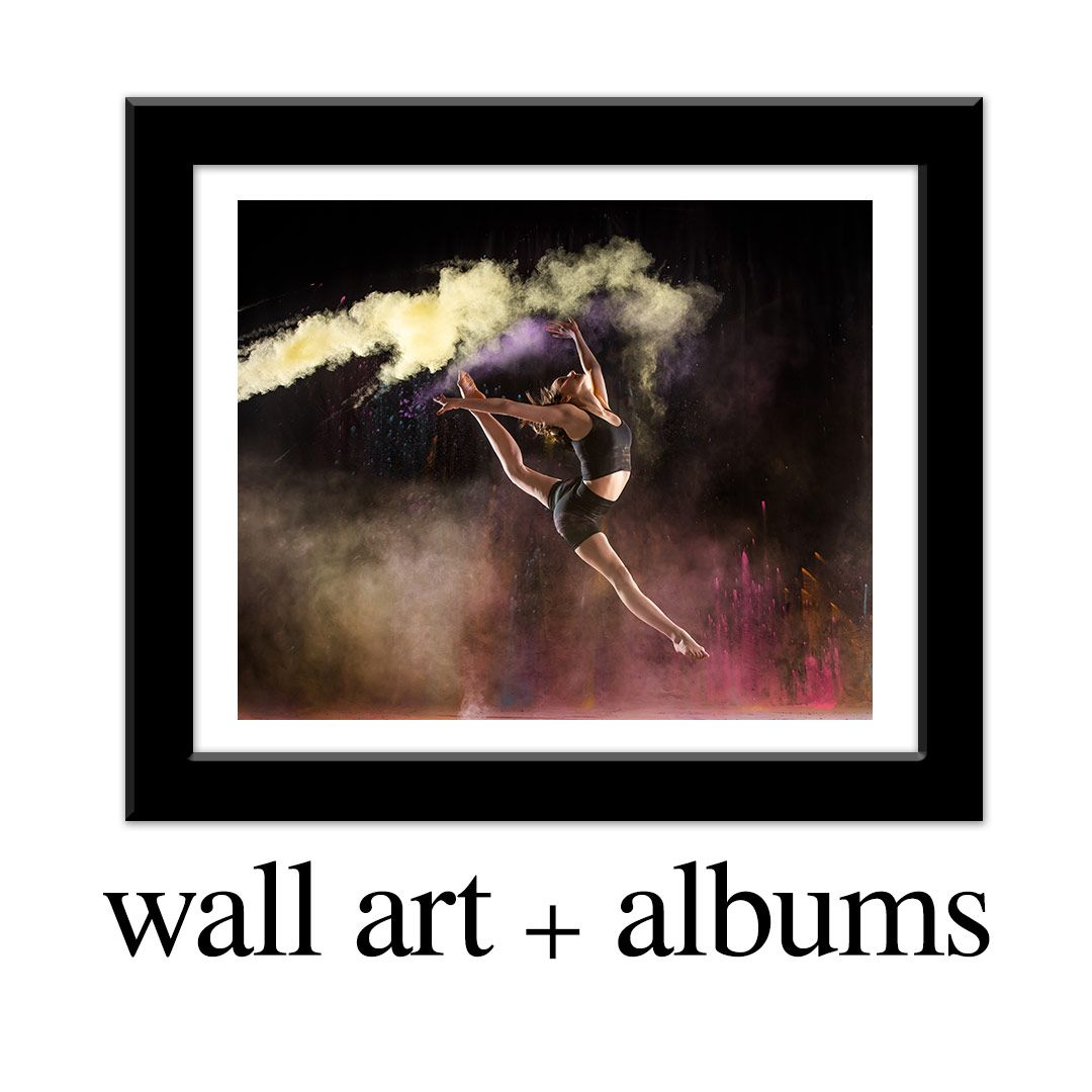 Framed wall art and album option featuring a dramatic dancer leaping with colorful powder smoke on dark background.