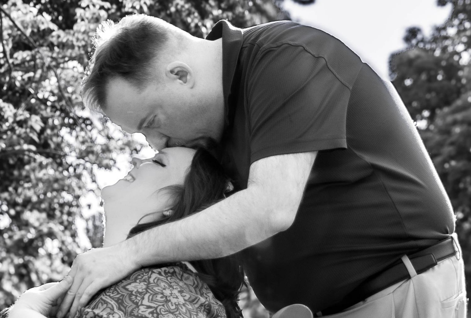 Central PA portrait couple session man kissing woman on forehead from behind by Millie D'Auria Photography