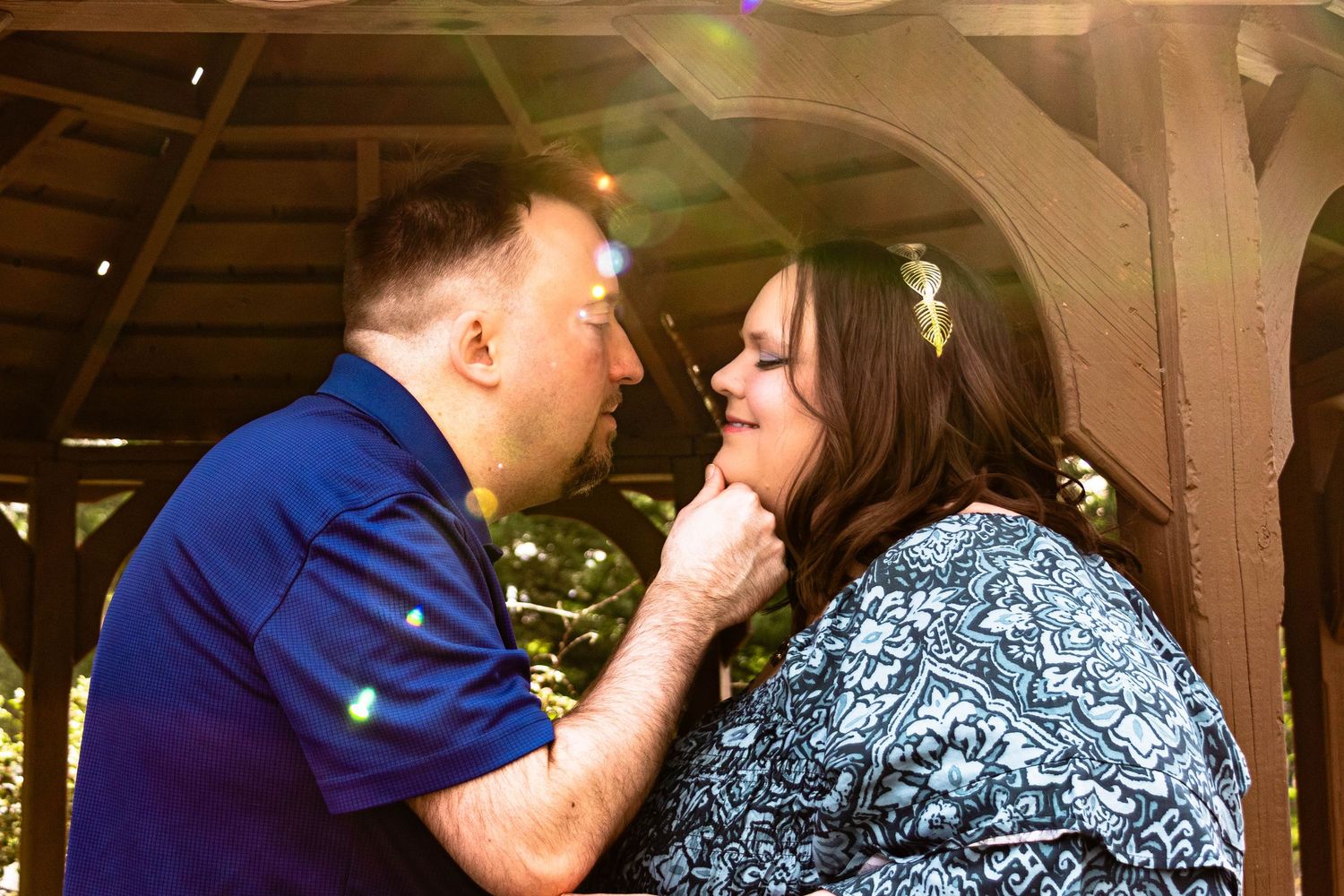 Central PA portrait couple session man and woman looking into each other's eyes man holding woman's chin by Millie D'Auria Photography