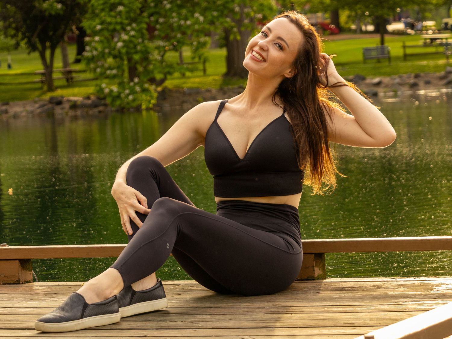 Central PA portrait solo session woman sitting on dock at Long's Park in Lancaster, PA by Millie D'Auria Photography
