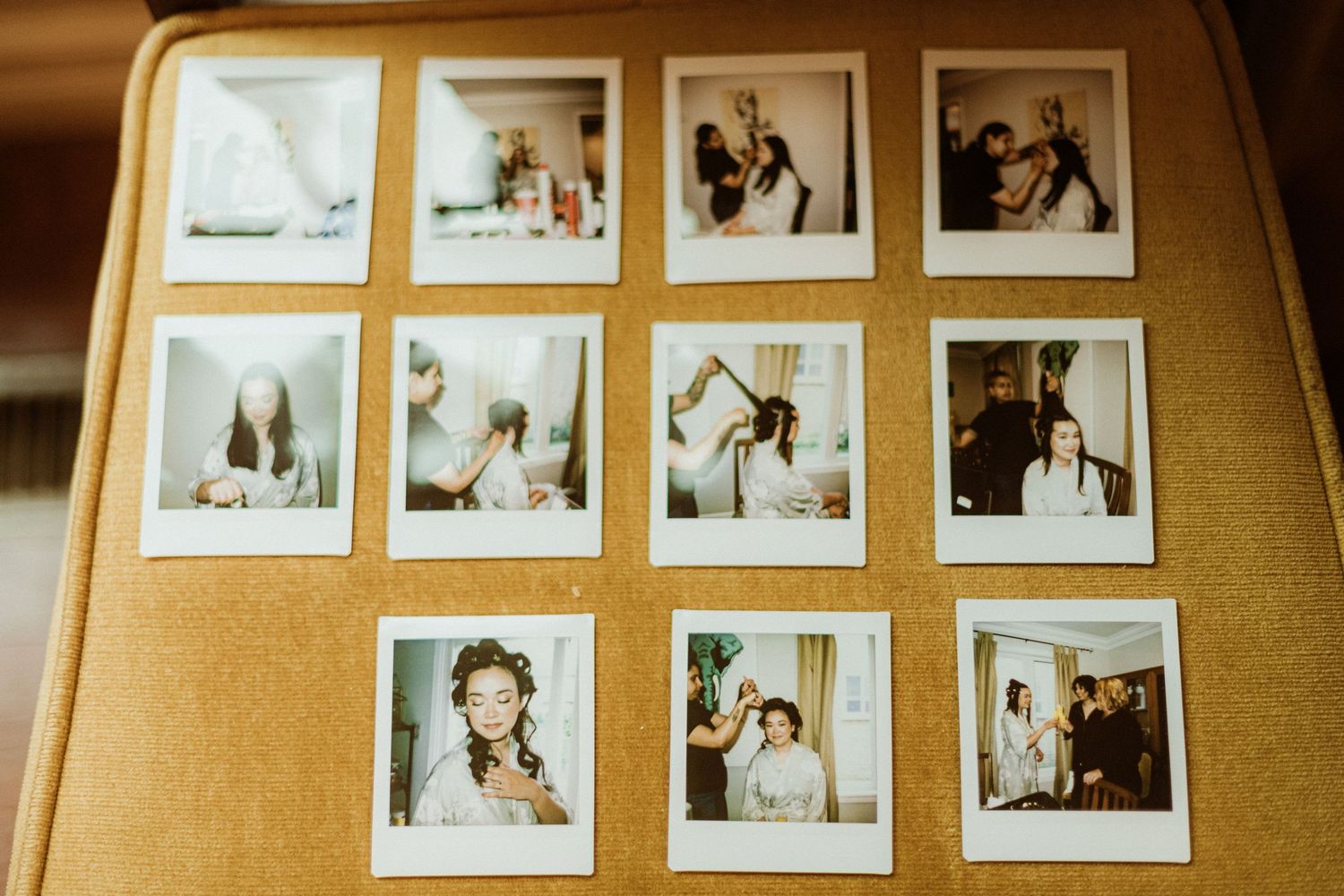 Grid of twelve Polaroid photos capturing candid bridal preparation moments arranged on a cork board.