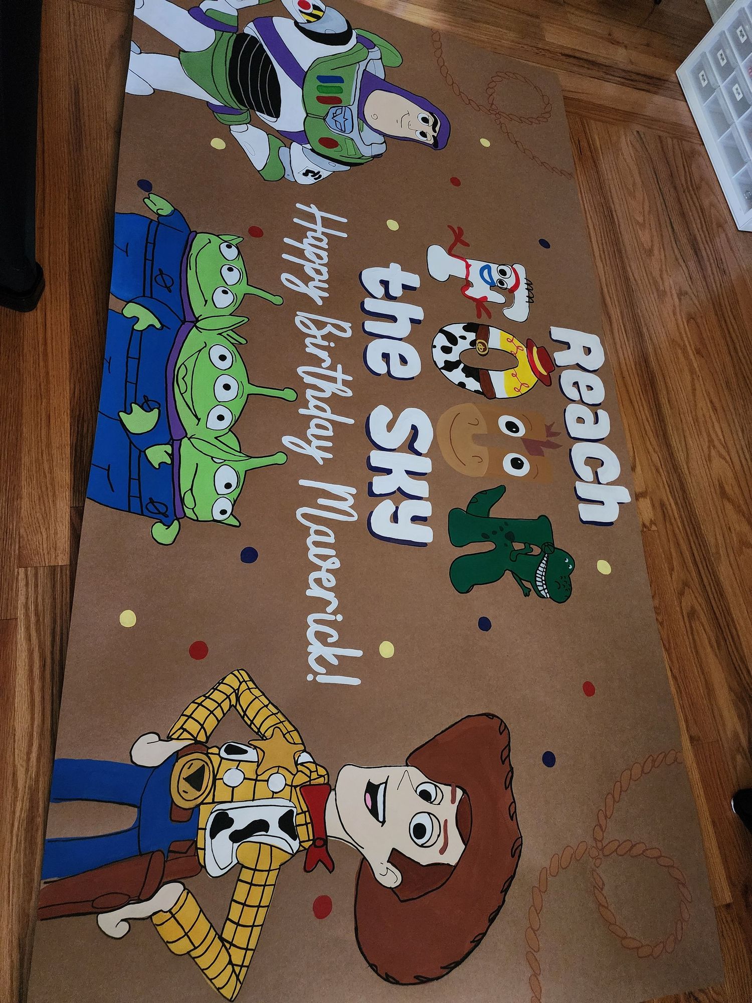 Toy Story birthday banner with Buzz, Woody, Jessie, and aliens reading Reach the Sky Happy Birthday Maverick.