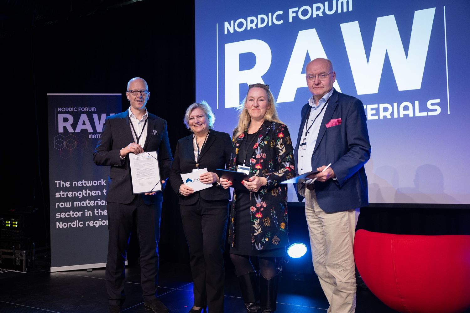 Four professionals pose together on stage at the Nordic Forum RAW Materials awards ceremony.