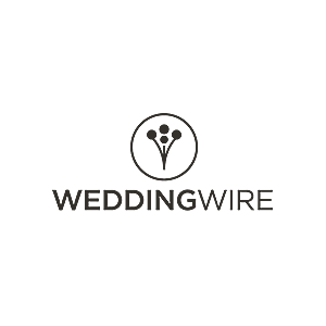 A black and white logo showing a circle emblem above the word WEDDINGWIRE.