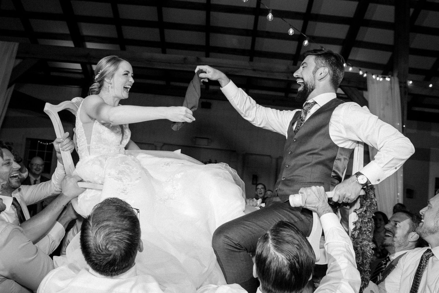 A series of black and white photos showing dancers performing energetic dance moves at a social gathering.