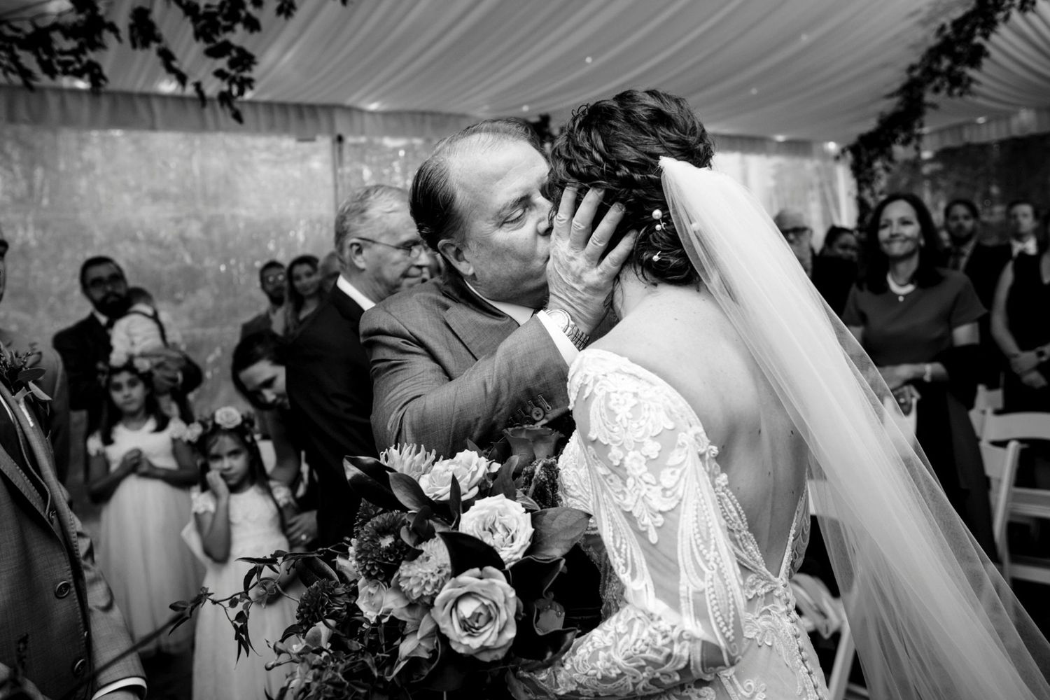 A black and white collage of wedding moments showing couples dancing, embracing and celebrating at their reception.