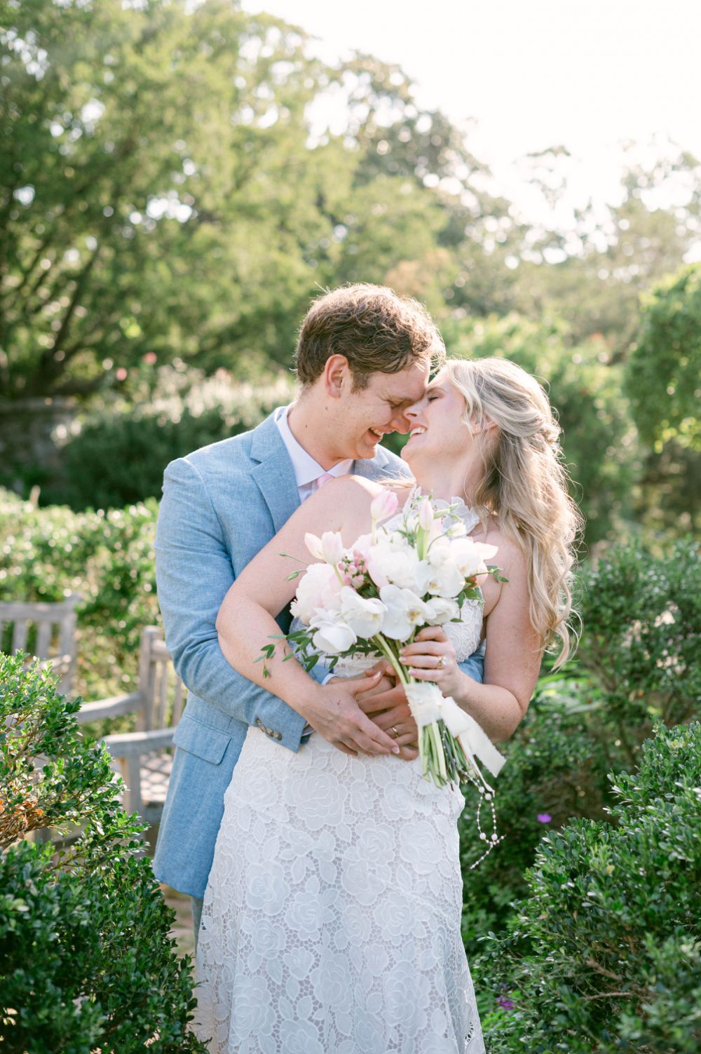 Emma holding white flower bouquet with light purple hydrangeas at National Cathedral wedding
