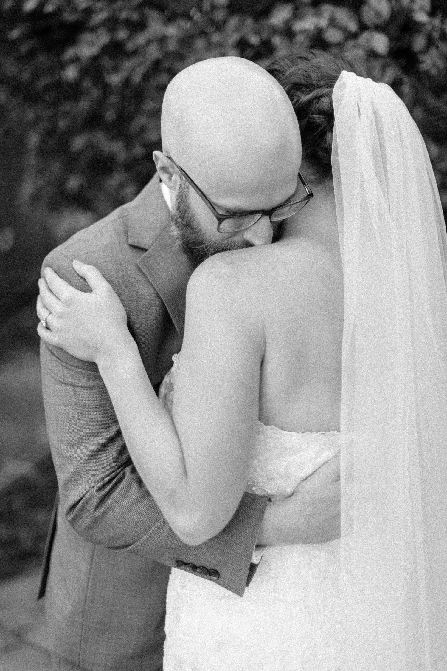 A romantic series of black and white photos showing a bride and groom in an intimate first look moment.