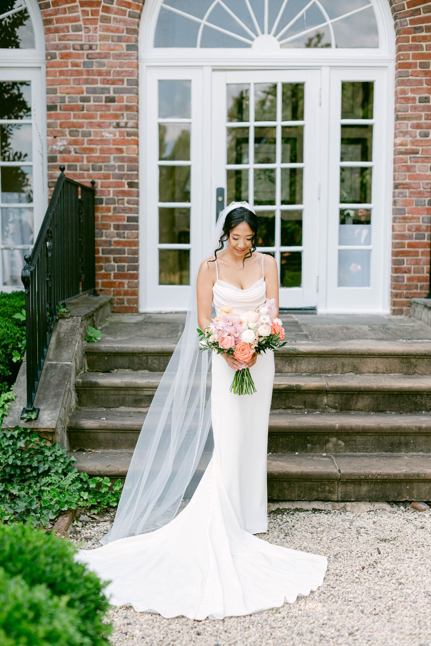 A series of bridal portraits showing a white wedding dress against a brick building backdrop with steps and greenery.