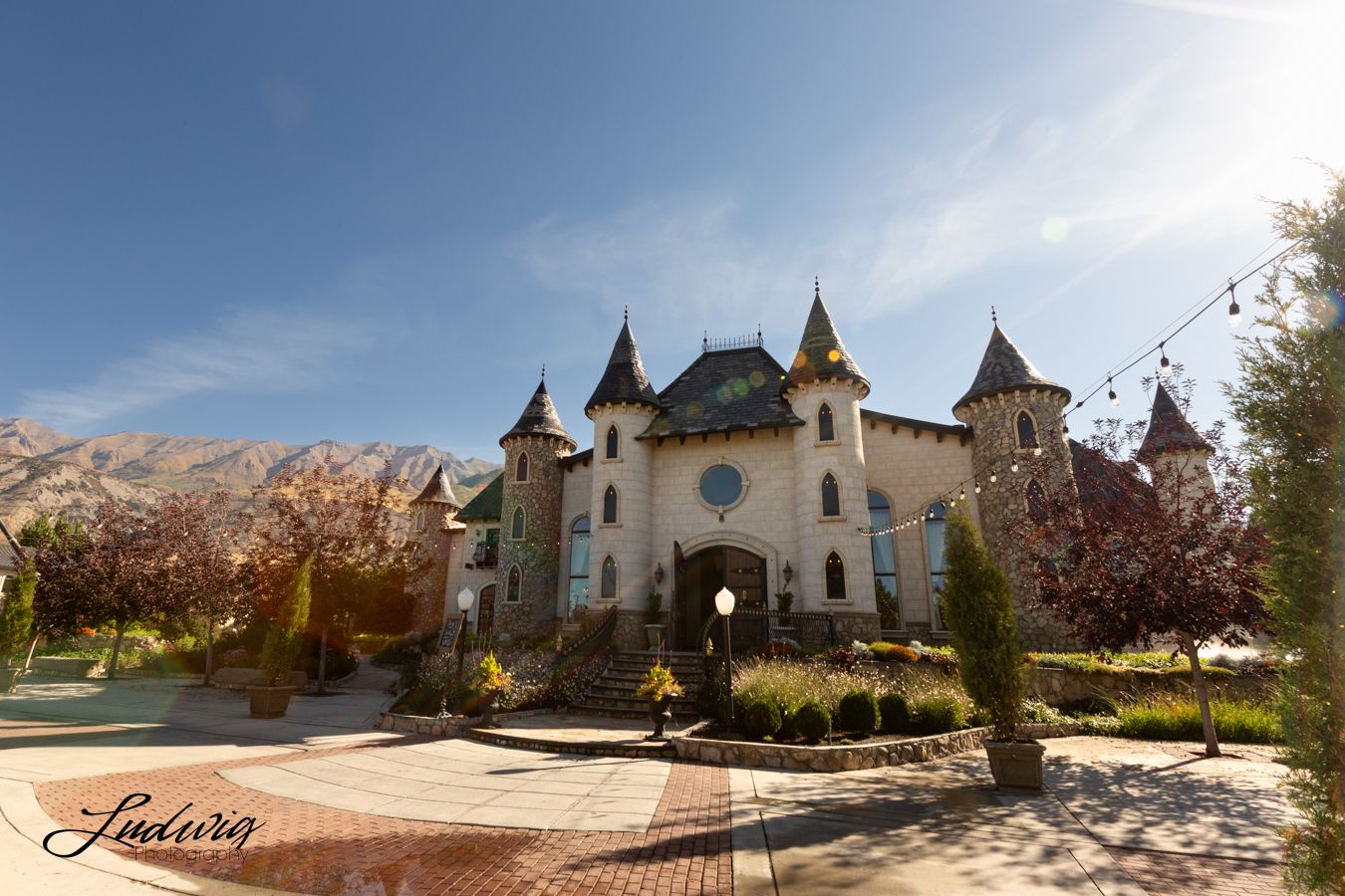The castle located at Wadley Farms Lindon, Utah in front of the Wasatch Range mountains and a beautiful blue sky.