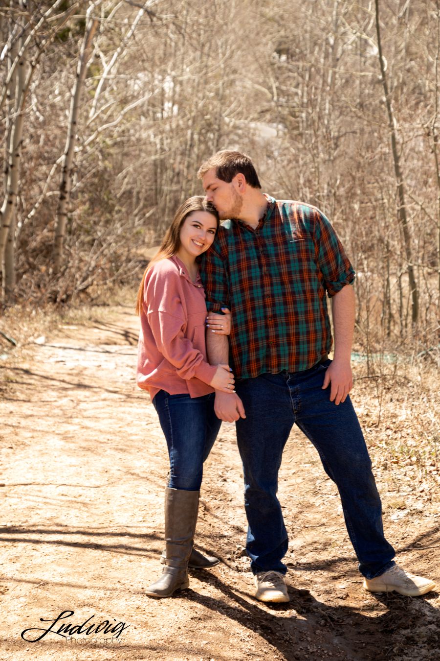 Photo of engaged couple at Yellow Pine, located in  Happy Jack Recreational area in the medicine bow national forest near Laramie, Wyoming.