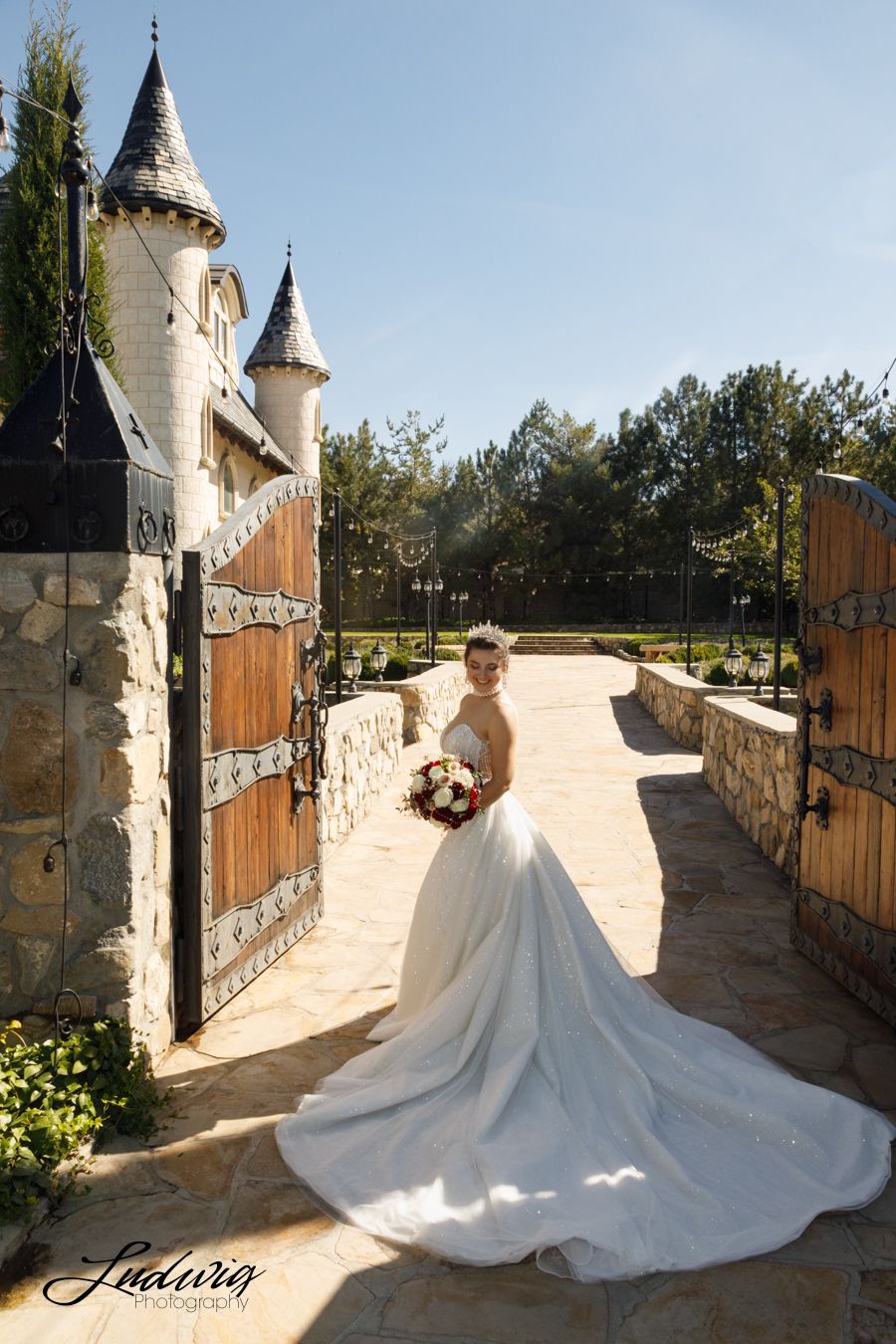Bride wearing a pearl-adorned Wona gown outside the castle at Wadley Farms in Lindon, Utah.