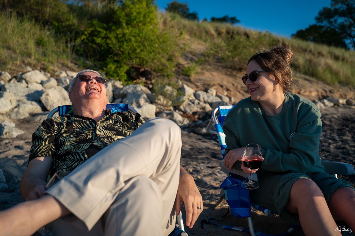 two people having a conversation at the beach