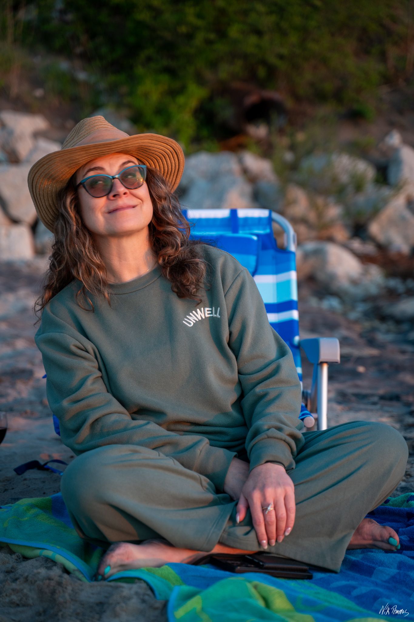 Lady sitting on sand