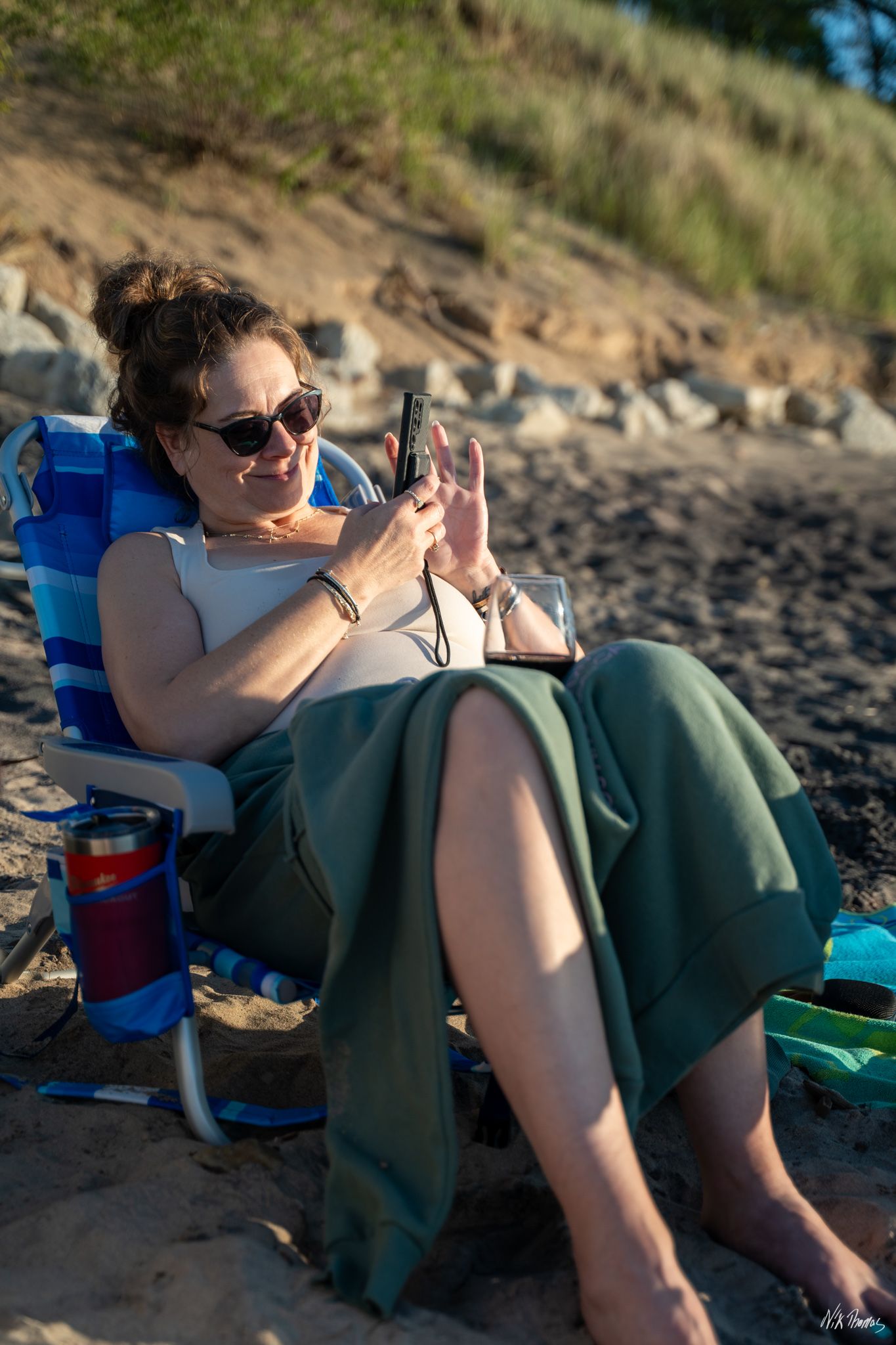 lady sitting in a chair at the beach