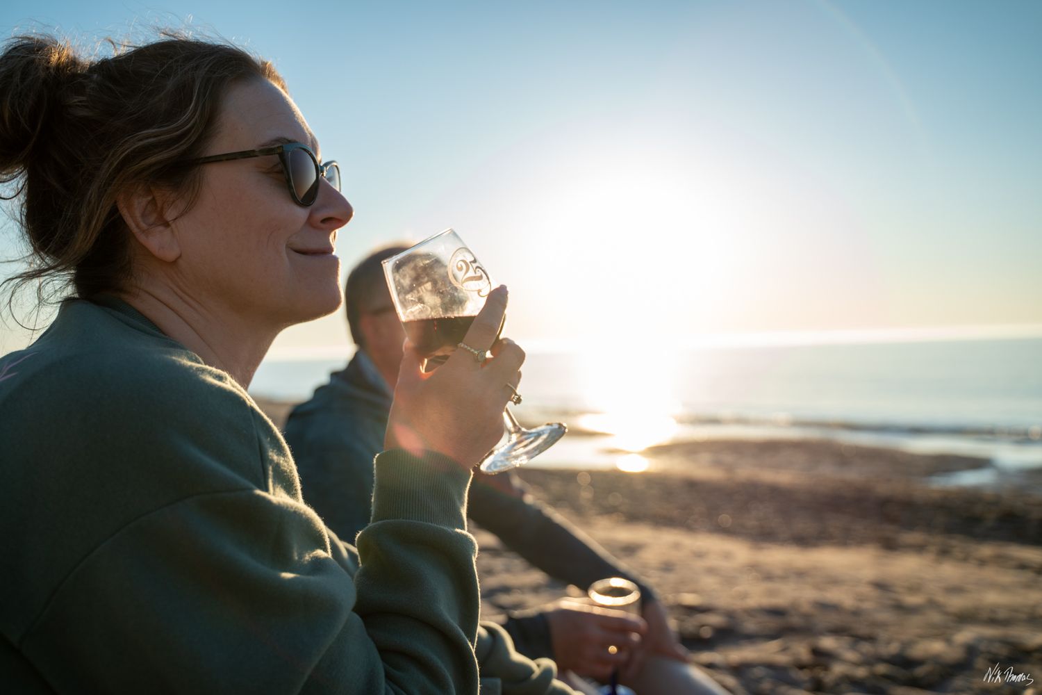 Lady smiling with sunset in the rear