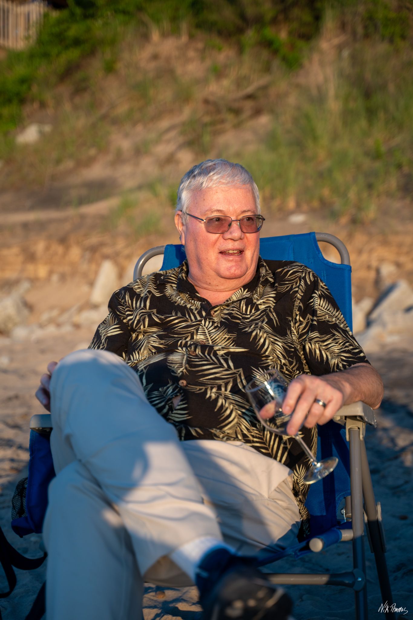 Man sitting in chair at the beach