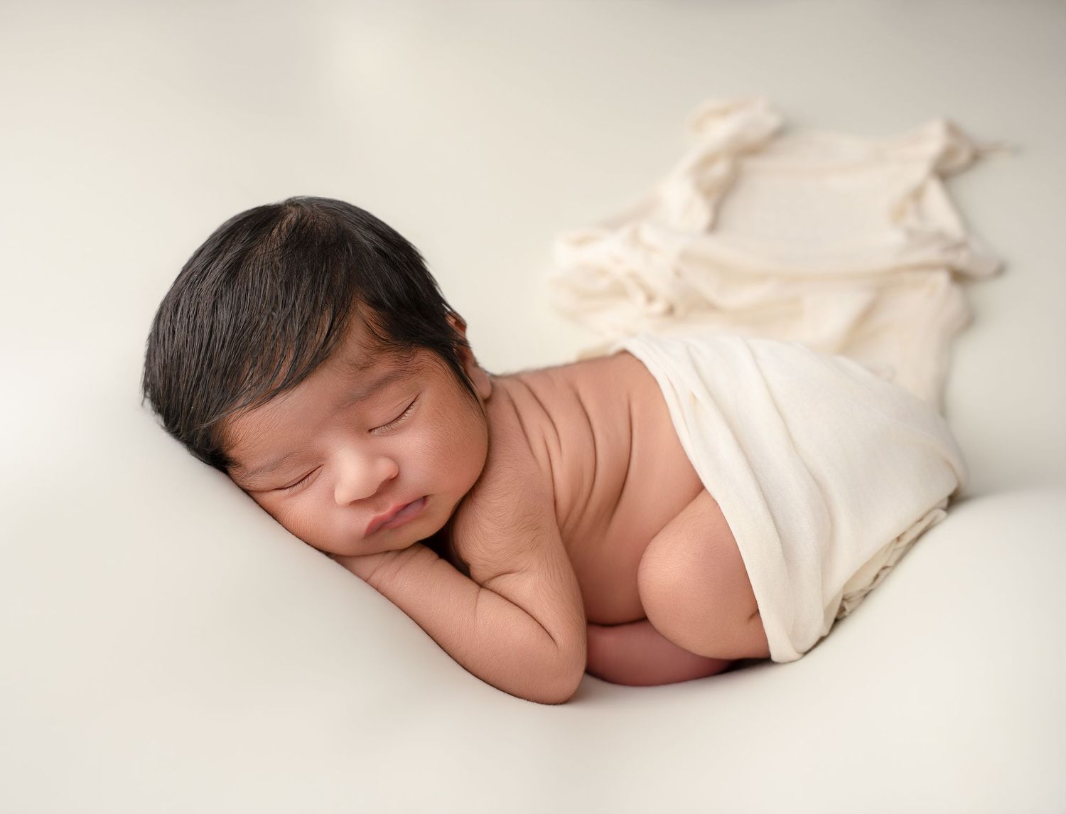 Relaxed newborn pose