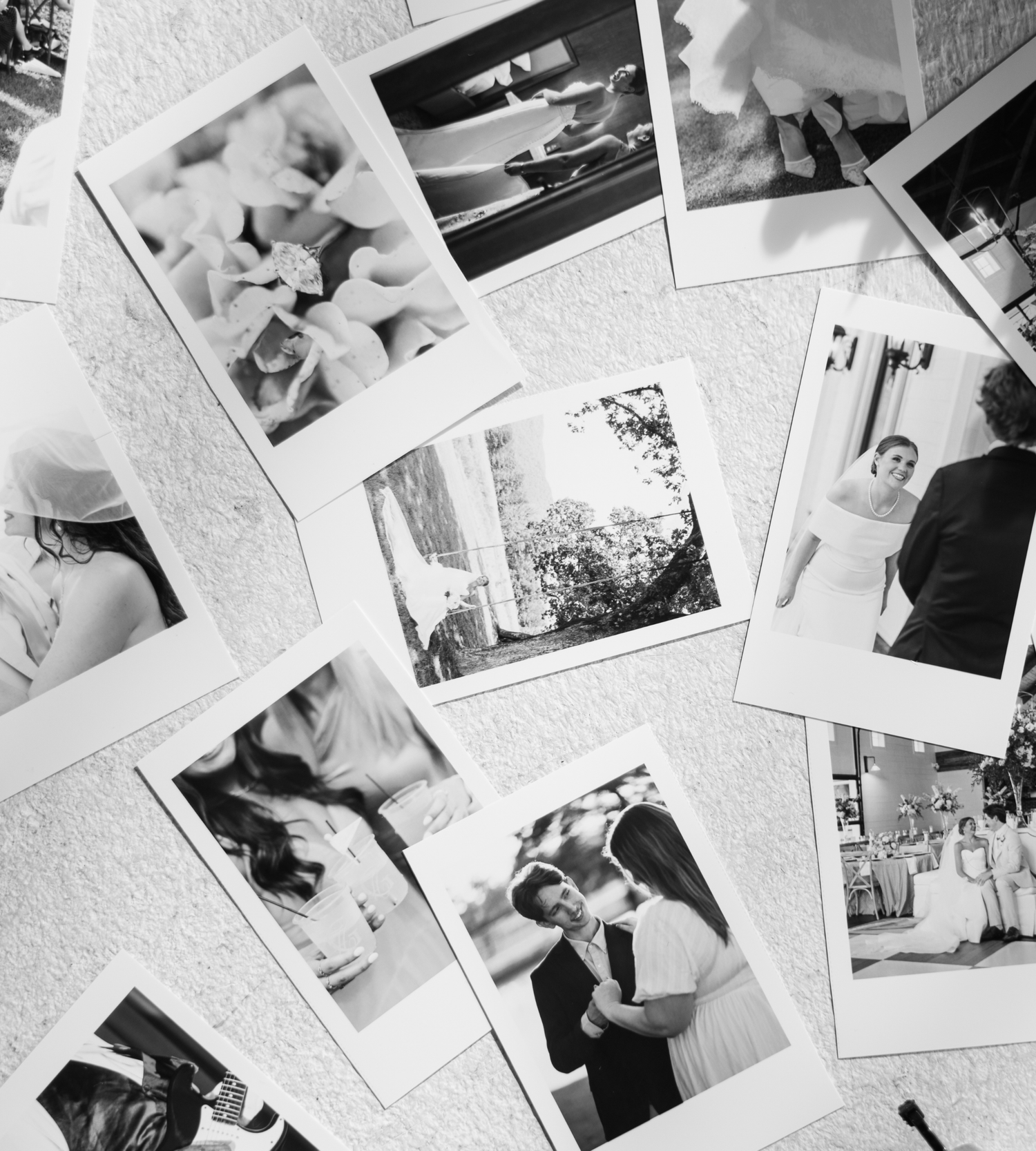 Black and white polaroid photos of a wedding spread on a table, capturing romantic moments of the bride and groom.