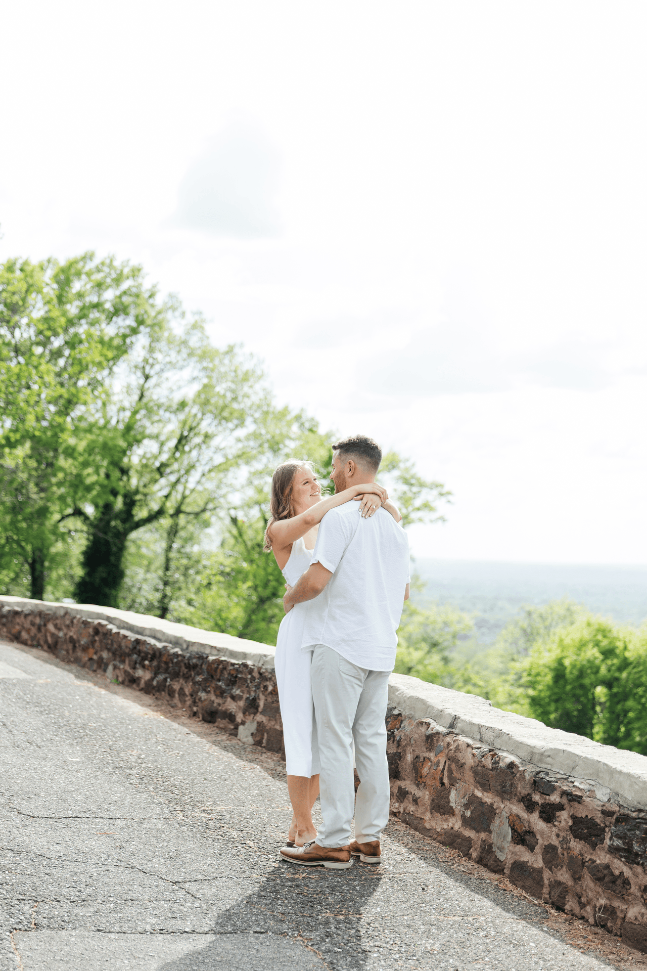 woman and man jumping on a road