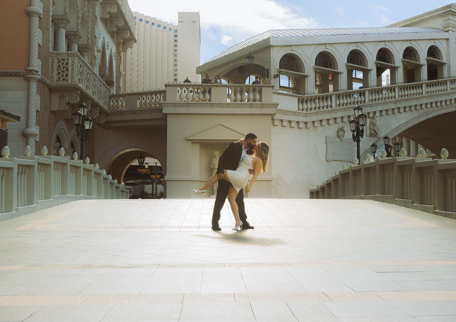 Couple shares a romantic dip at the Venetian Resort outdoor plaza in Las Vegas.