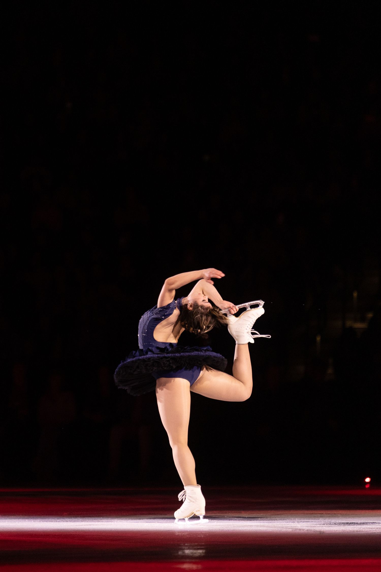 Alysa Liu, figure skater, preforming a haircutter spin, during her stateside program