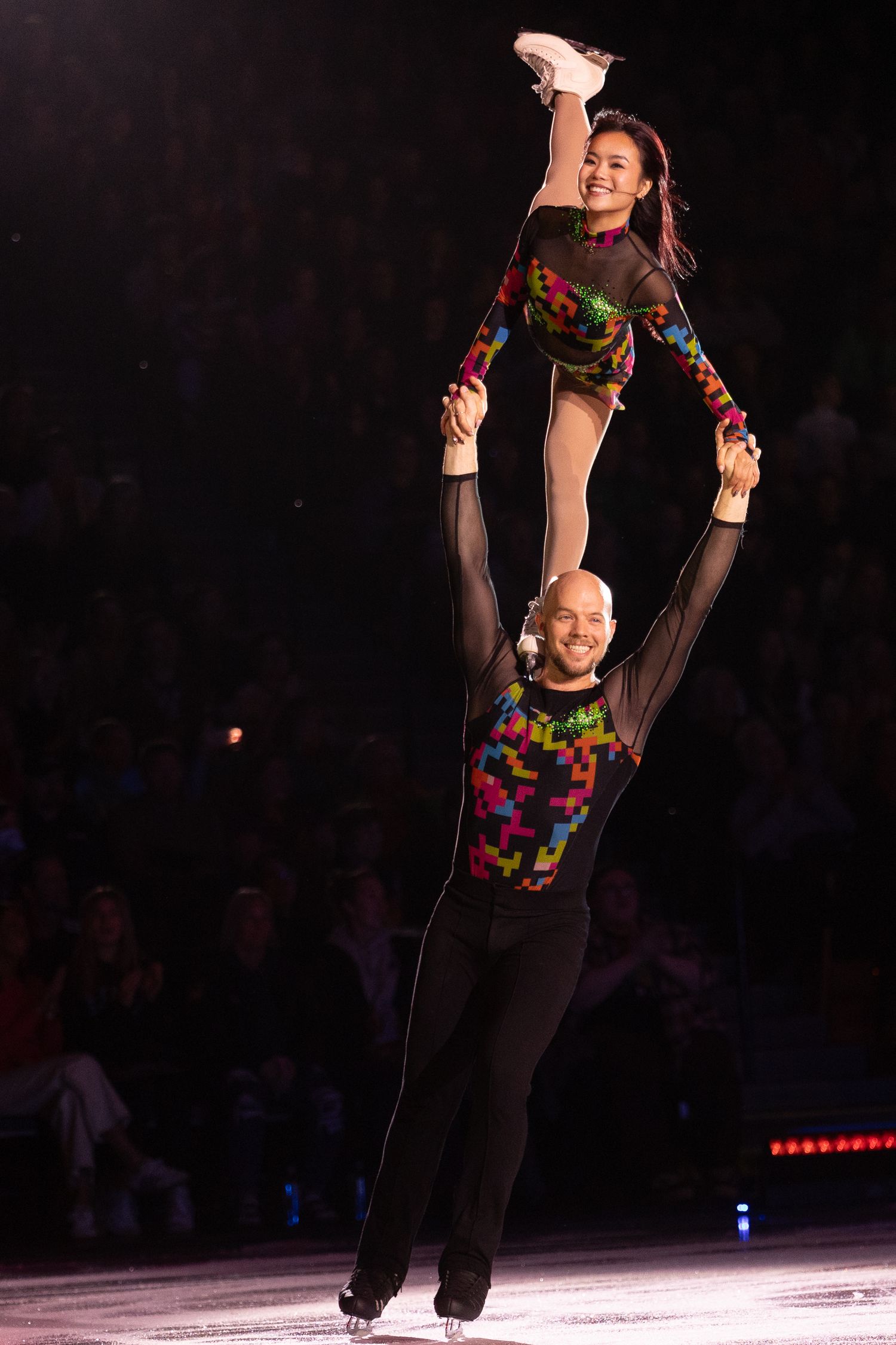 two figure skaters, Danny O Shea and Ellie Kam, preforming a pairs lift.