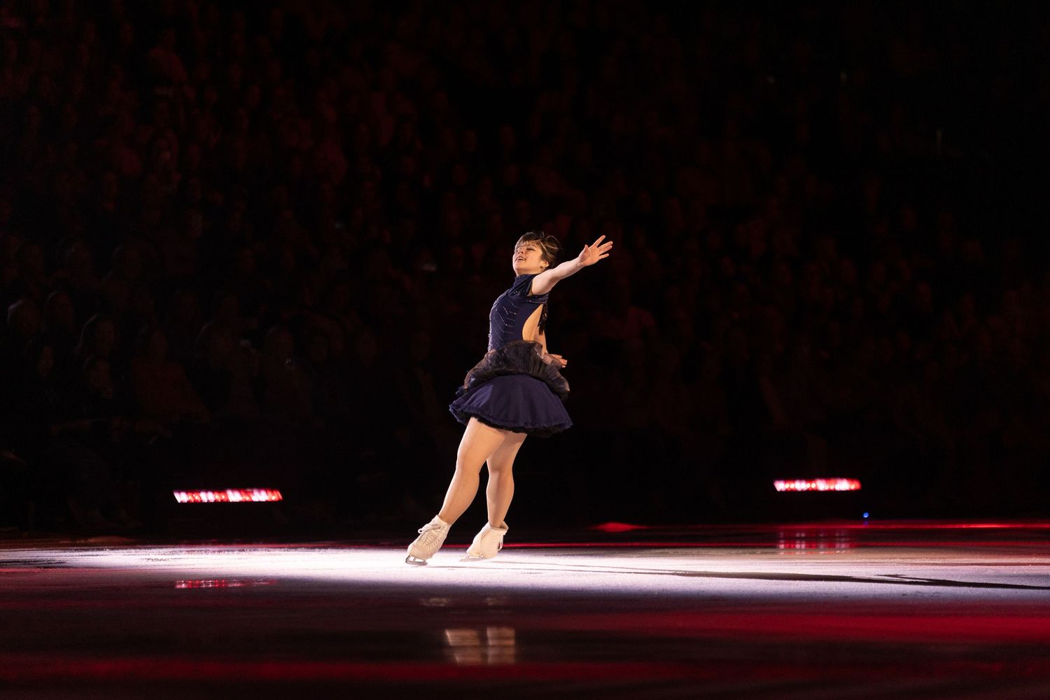 alysa liu, figure skater, preforming a spread eagle during her stateside program.