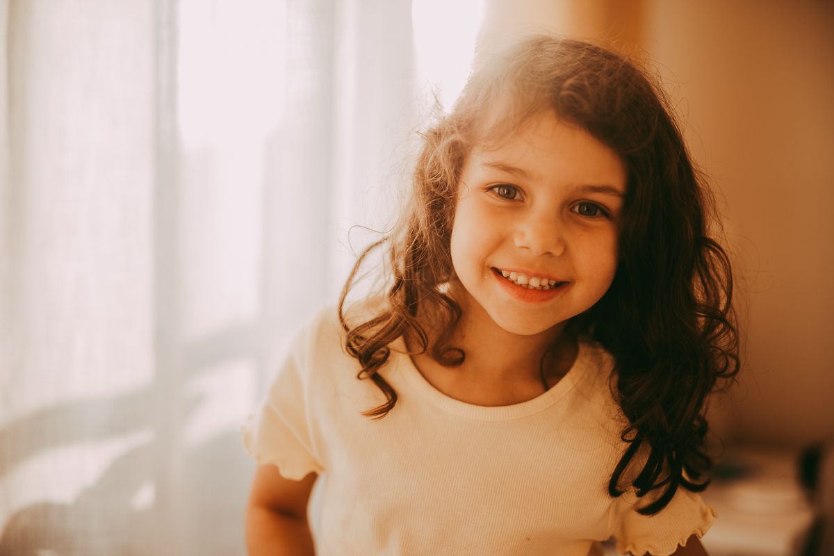 Natural light family photographer in Dundee and Angus capturing real moments during a home photoshoot