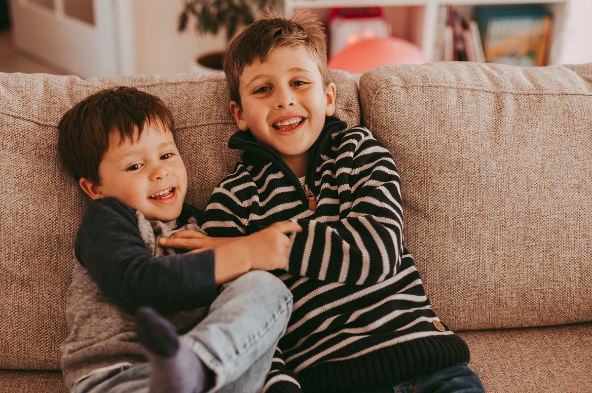 Natural light family photographer in Dundee and Angus capturing real moments during a home photoshoot