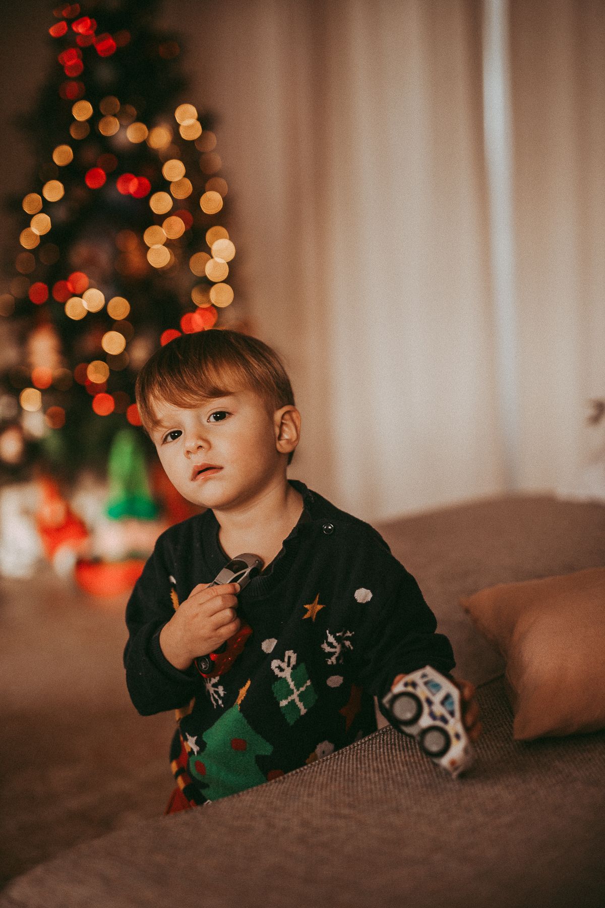 Christmas portrait of a child, documentary-style family photography capturing everyday life