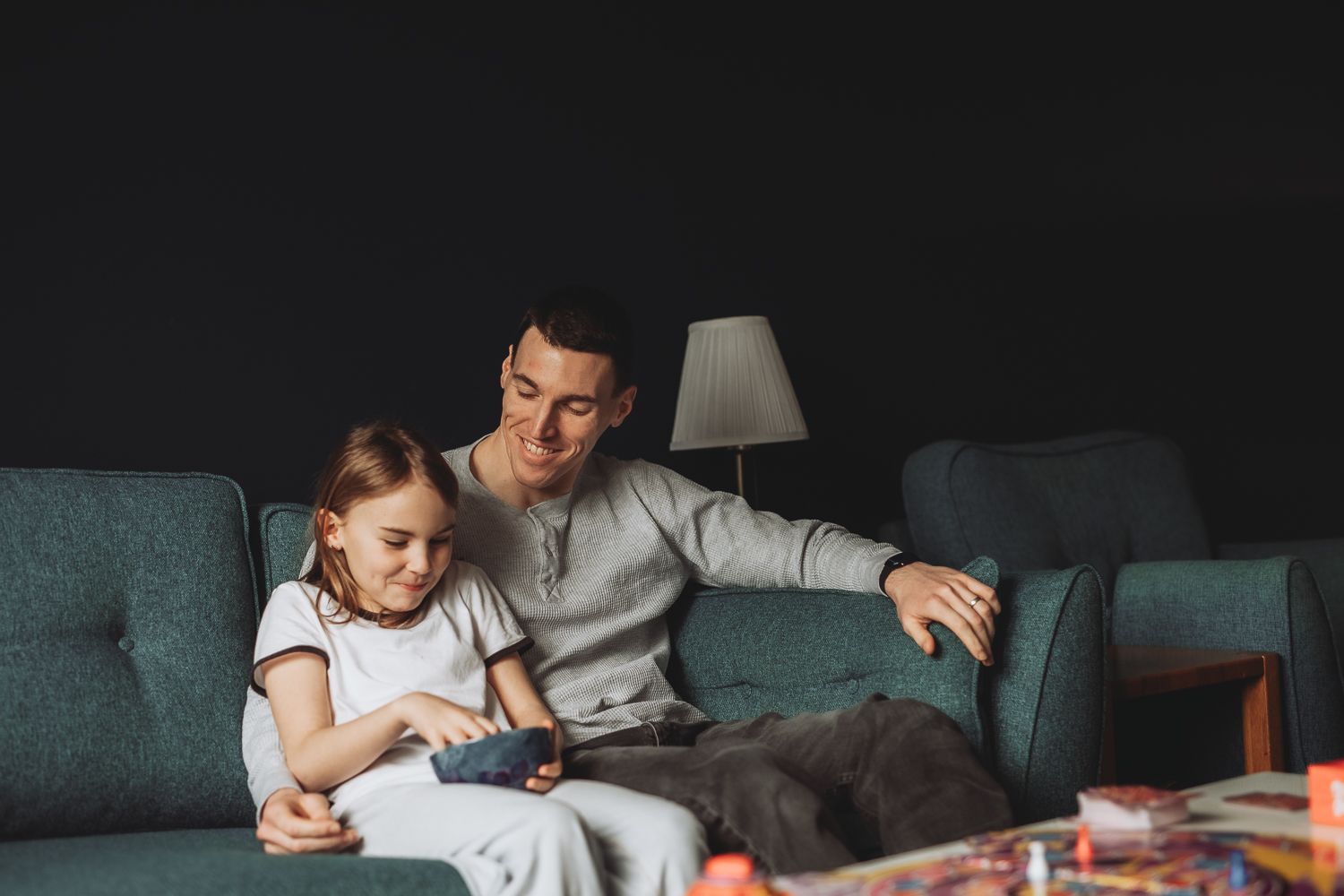 Candid moment between father and daughter during home photoshoot in Angus