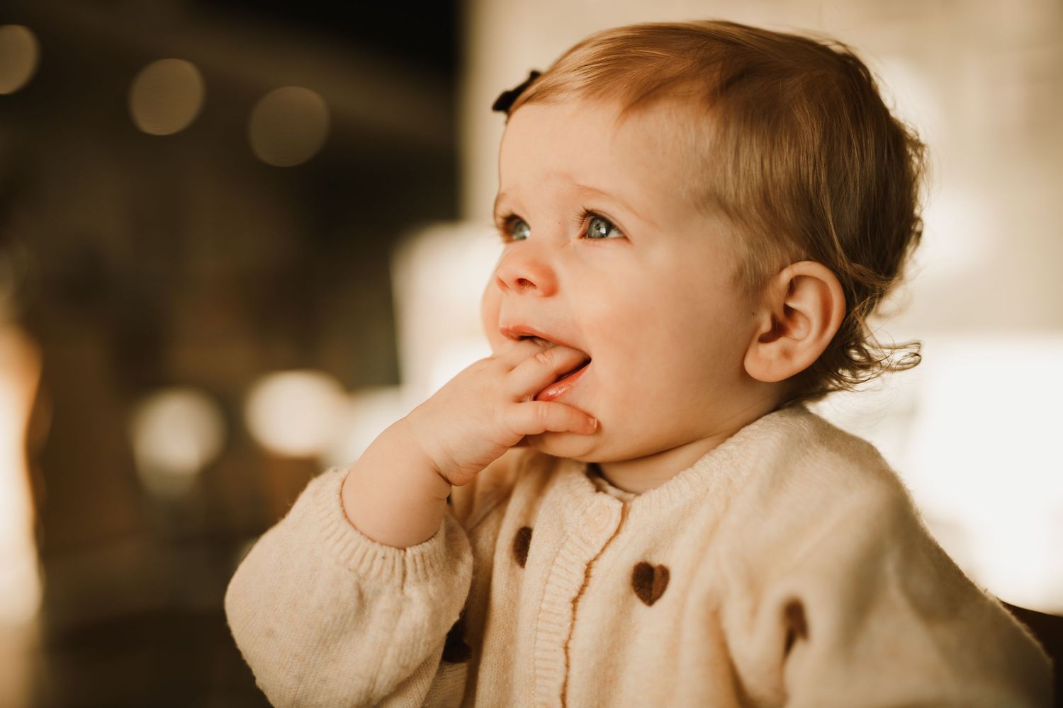 A toddler during a family photoshoot indoors