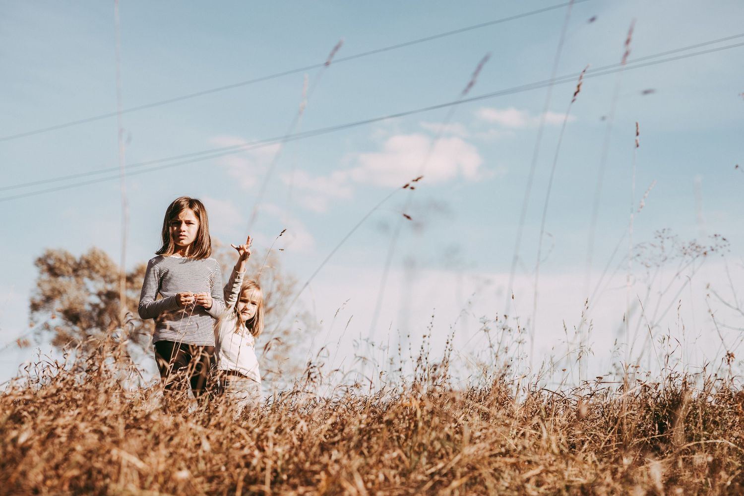 Outdoor family photography with children playing outdoors