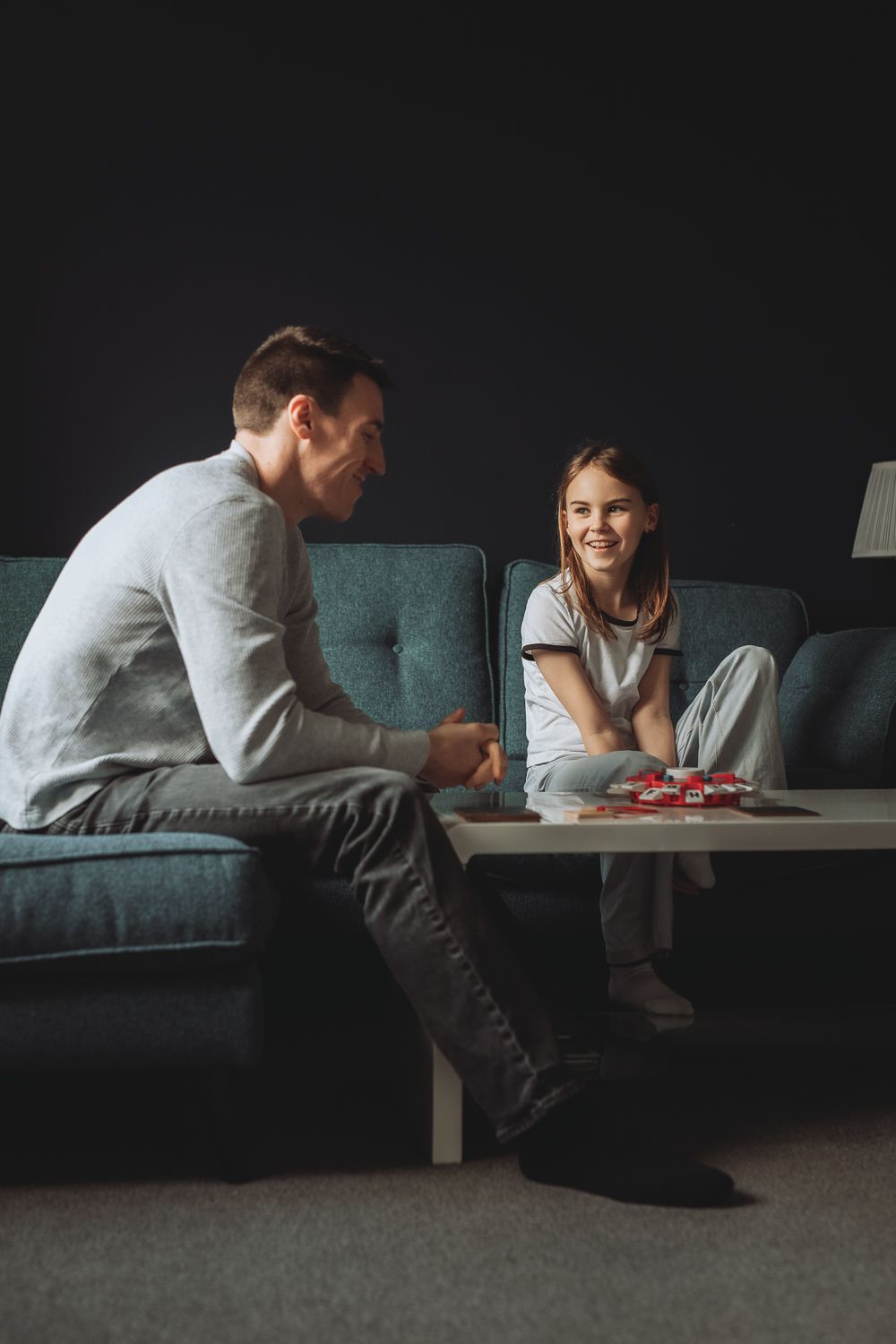 Father and daughter during a relaced family photoshoot indoors