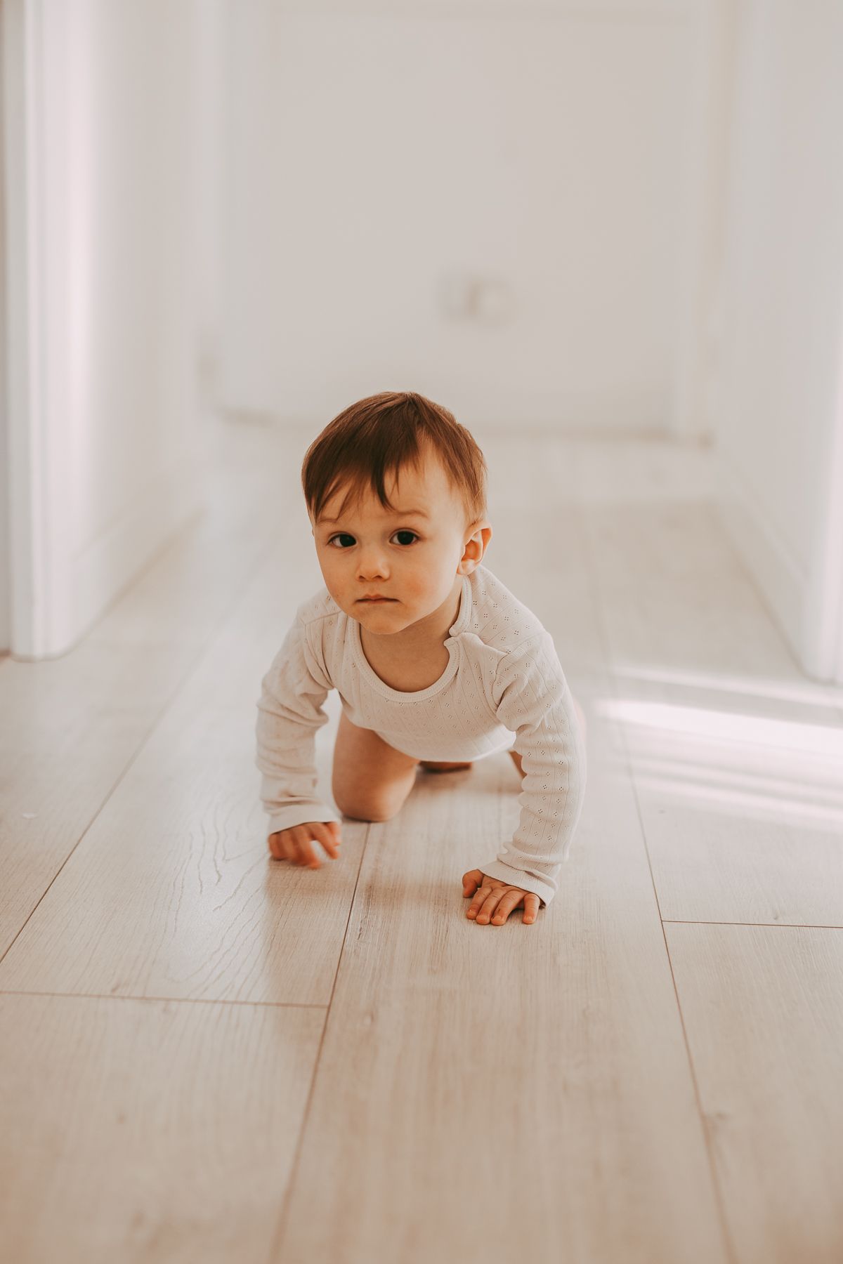 Natural light family photographer in Dundee and Angus capturing real moments during a home photoshoot