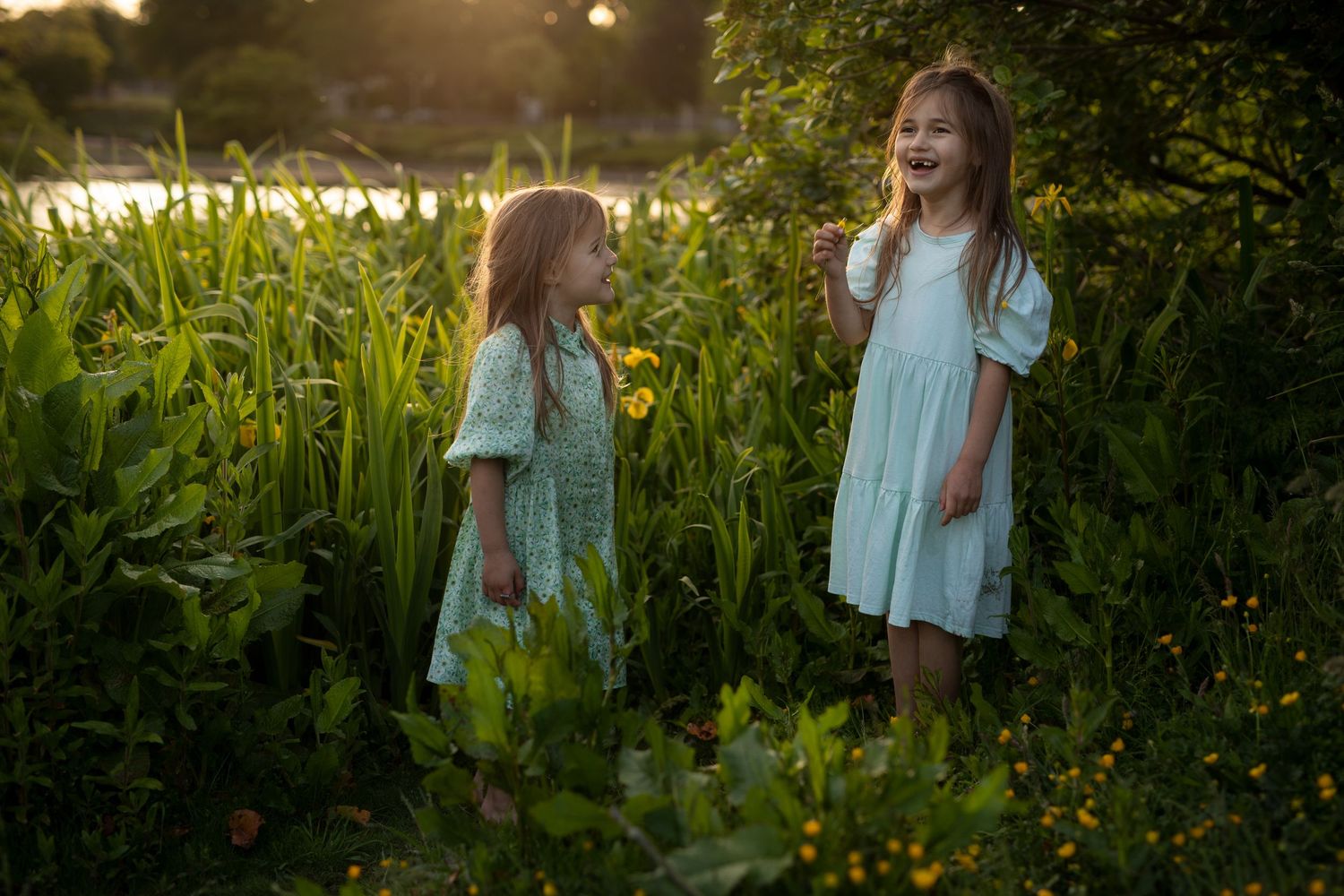 Children laughing during natural family photography session outdoors in Angus