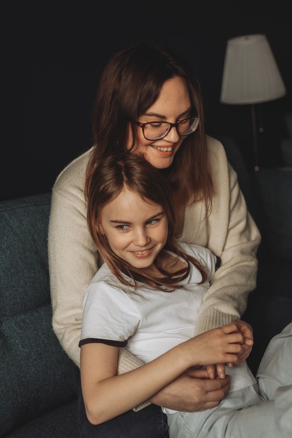 Candid moment between mother and daughter during home photoshoot in Angus